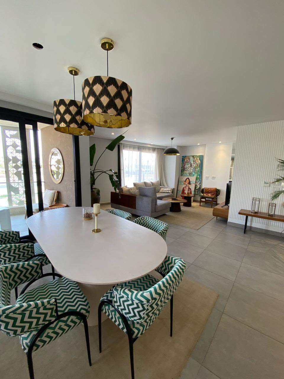 Living and dining — Furnished living and dining area in a show home.