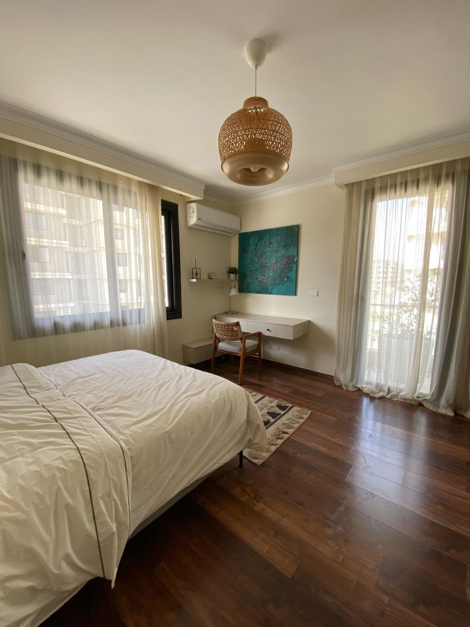 Bedroom — Bedroom with a study desk and balcony access.